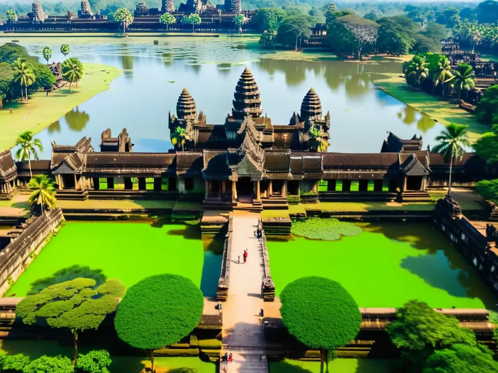 Vista aérea de Angkor Wat rodeado de exuberante vegetación y reflejándose en el agua tranquila del foso